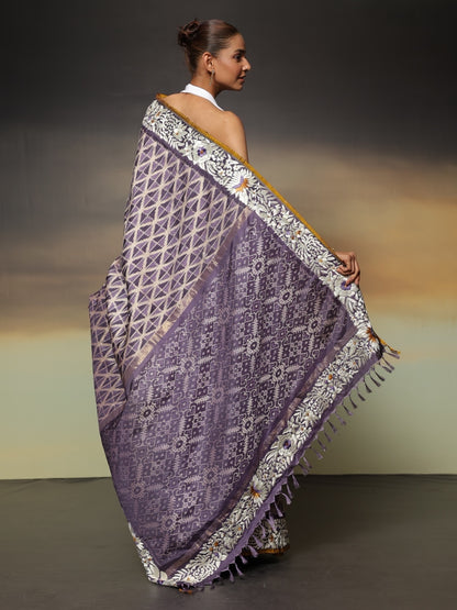 The stunning piece of art features tie-dyed ikkat in a captivating lavender shade with intricate Parsi Gara hand embroidery work