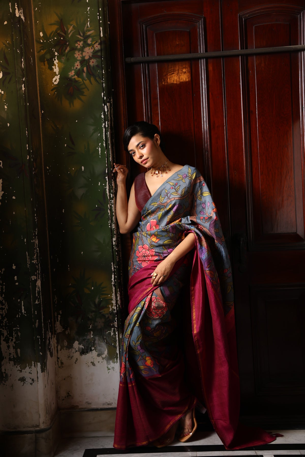 A korvai contemporary kanchivaram silk saree one sided border adorned with chintz penkalamkari