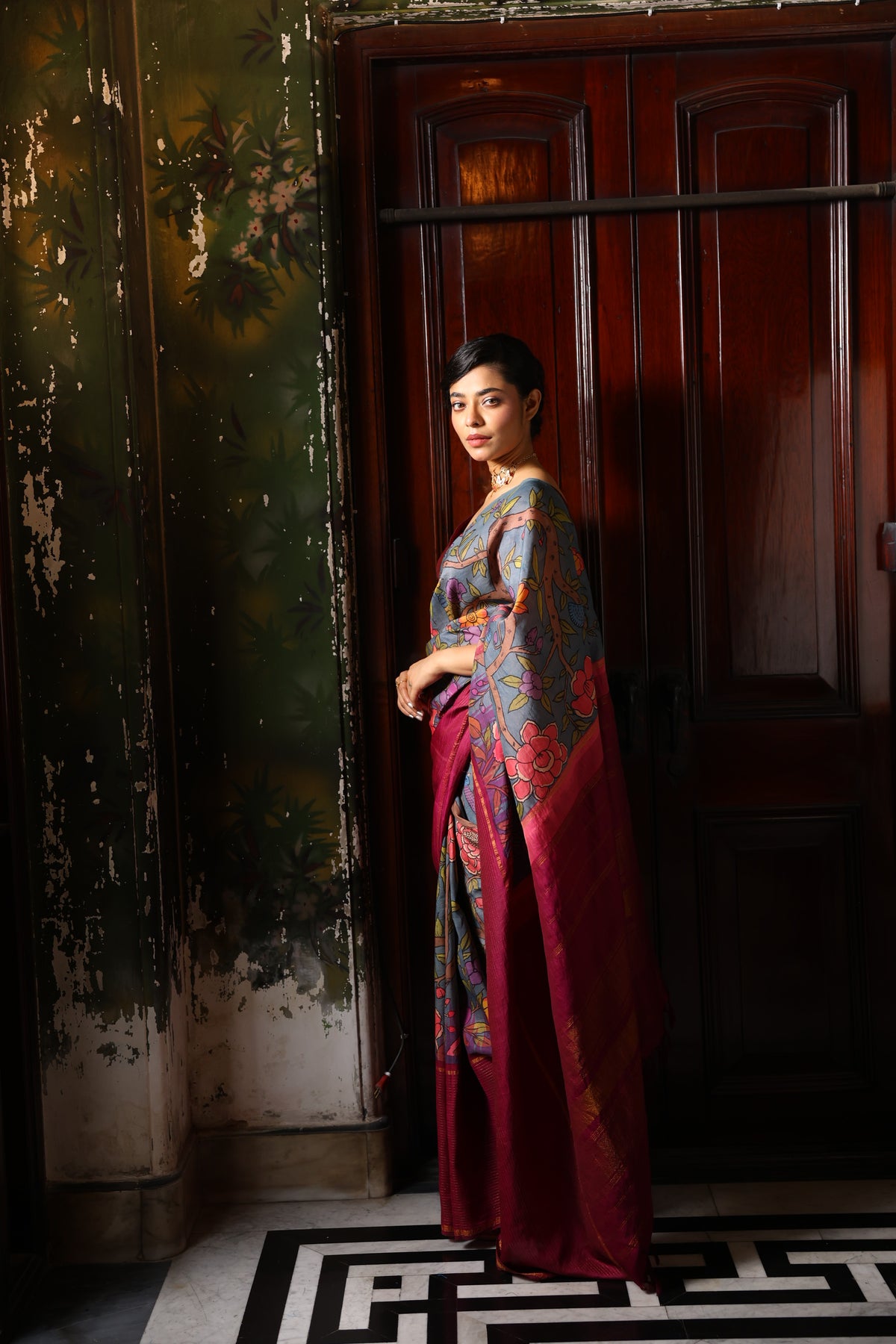 A korvai contemporary kanchivaram silk saree one sided border adorned with chintz penkalamkari
