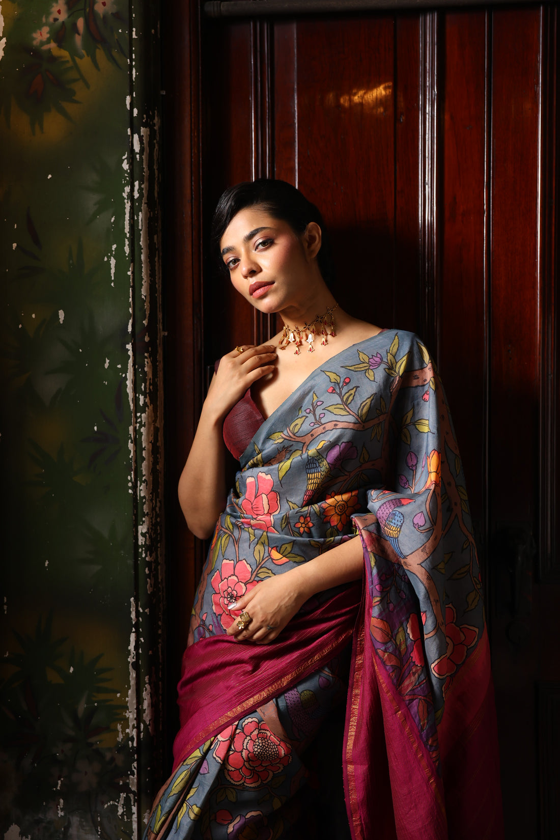 A korvai contemporary kanchivaram silk saree one sided border adorned with chintz penkalamkari