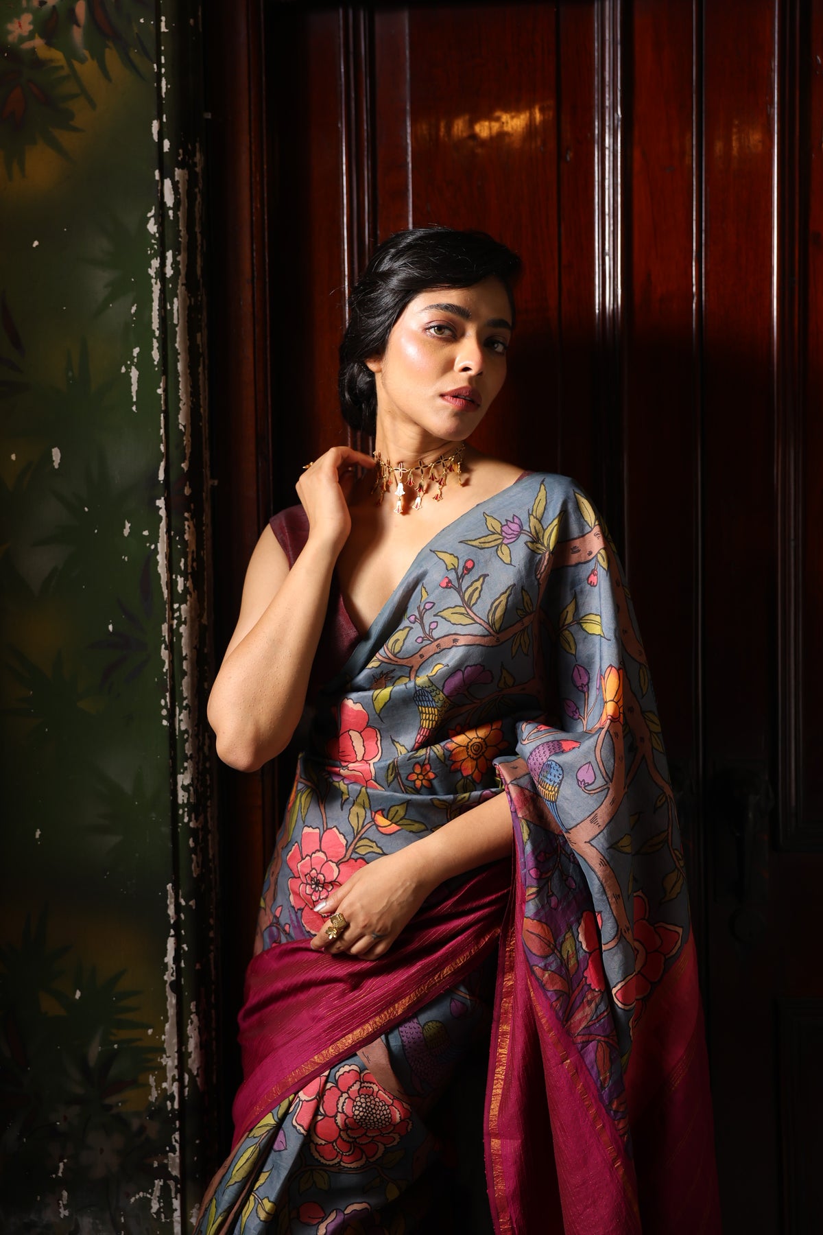 A korvai contemporary kanchivaram silk saree one sided border adorned with chintz penkalamkari