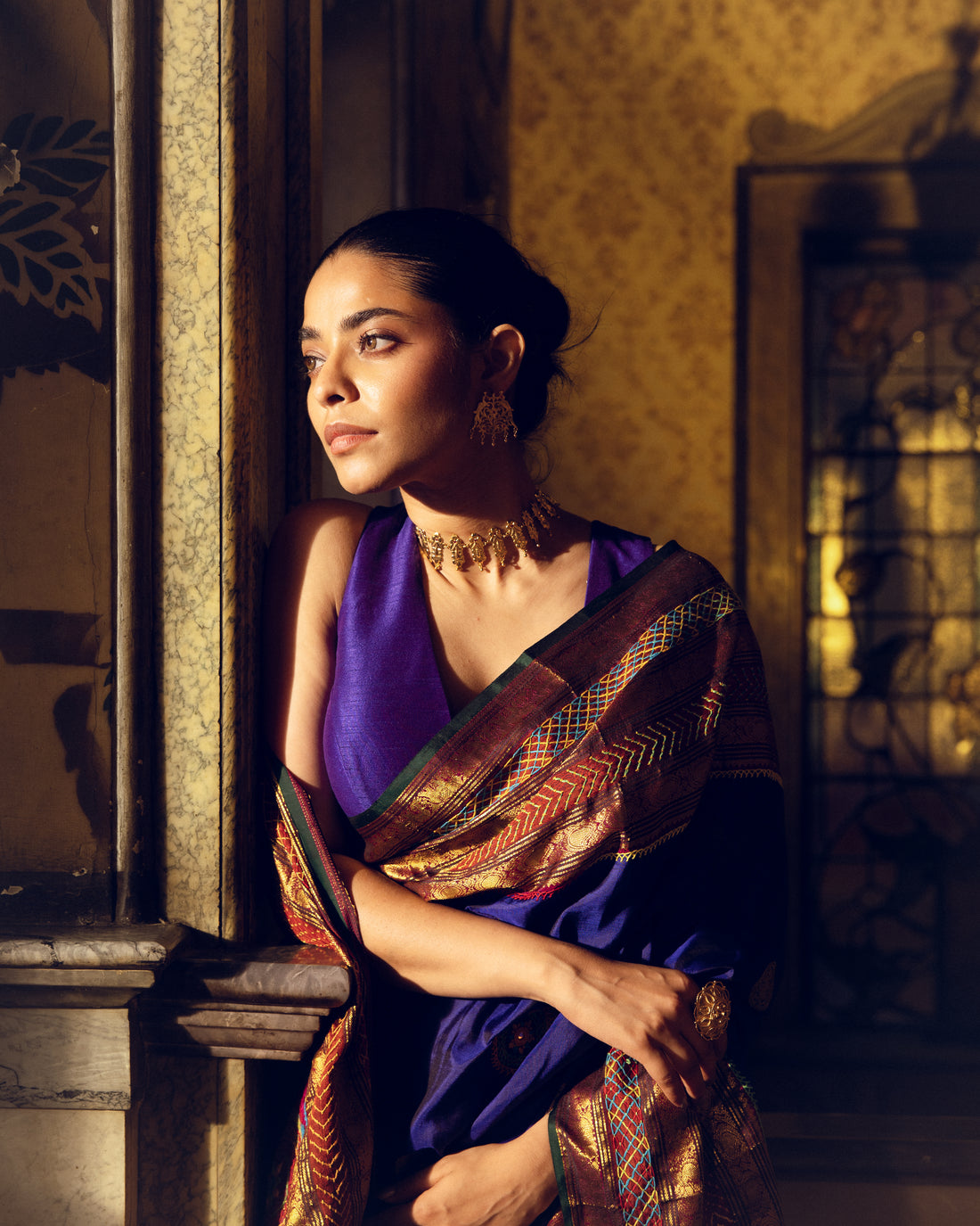 Handwoven pure kanchivaram silk saree blue with purple shot adorned with an exquisite handmade lambani mirror work