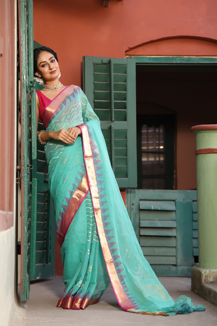 A brand exclusive Seagreen Ponduru khadi Jamdani Handspun with beautiful lotus weave and chevrons