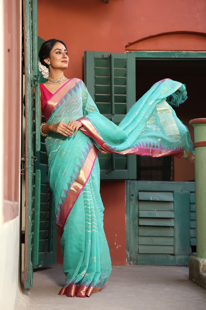 A brand exclusive Seagreen Ponduru khadi Jamdani Handspun with beautiful lotus weave and chevrons