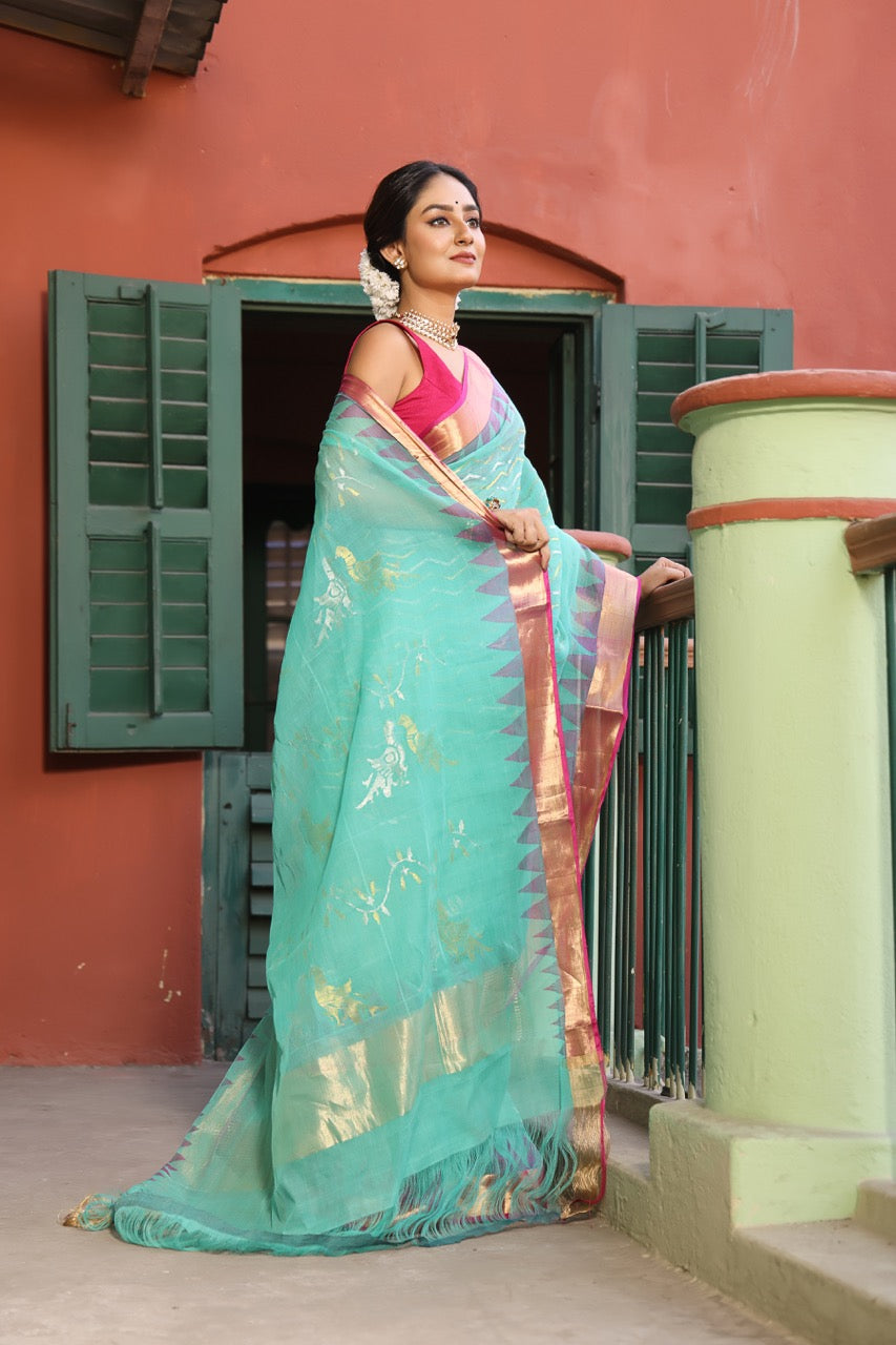 A brand exclusive Seagreen Ponduru khadi Jamdani Handspun with beautiful lotus weave and chevrons