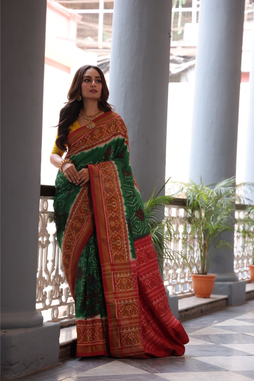 THARAGAI - Handknotted tie dyed Bhandej Ikkat silk saree with hand drawn and handpainted Penkanamkari Saree