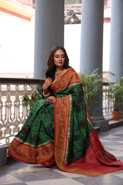 THARAGAI - Handknotted tie dyed Bhandej Ikkat silk saree with hand drawn and handpainted Penkanamkari Saree