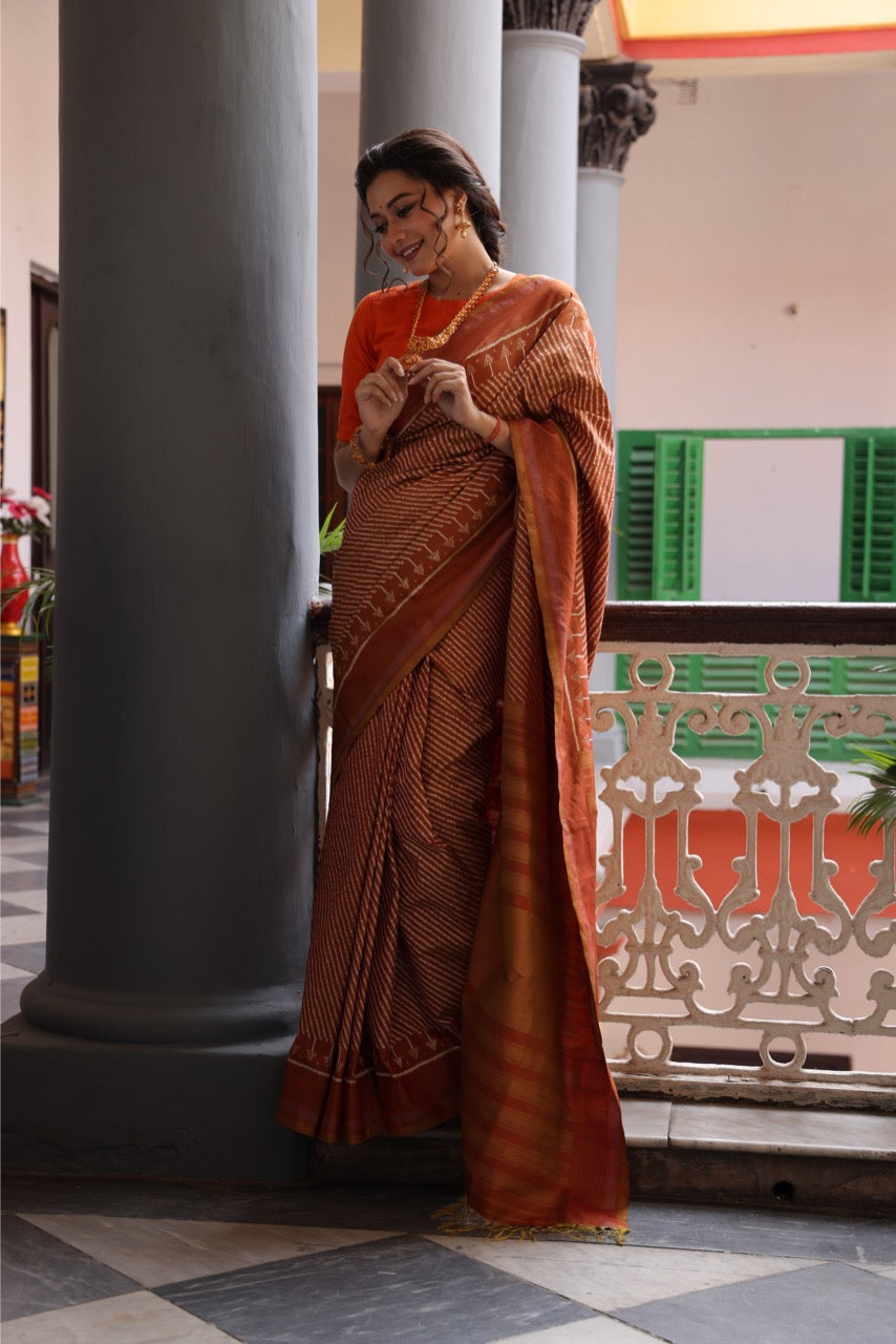 Natural Dye Silk Ikkat Saree In Lehariya Pattern In rustic orange with muted Gold Shade