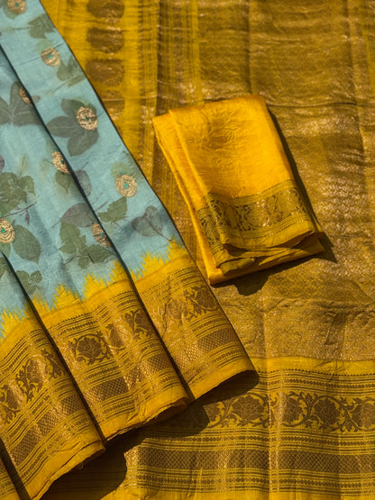 A gorgeous natural ecoprints done on pastel mint green with yellow kuttu gadwal silk saree