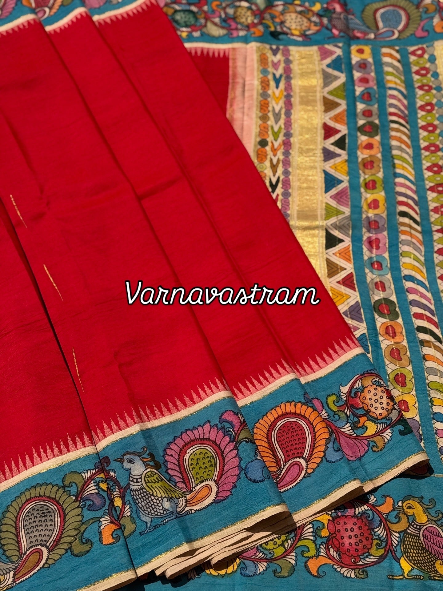 A gorgeous red korvai kanchivaram silk saree with korvai border Handdrawn and handpainted penkalamkari