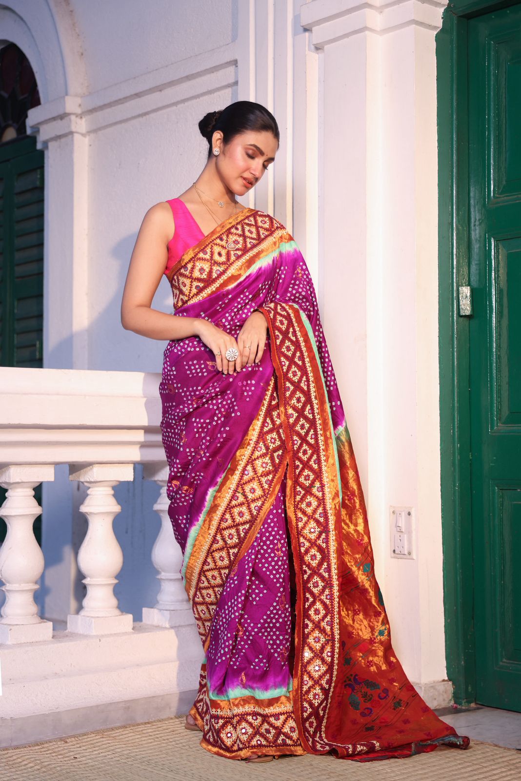 Intricate art piece blending Paithani Muniya with hand-knotted Bhandej and embellished with Kutch mirror work border