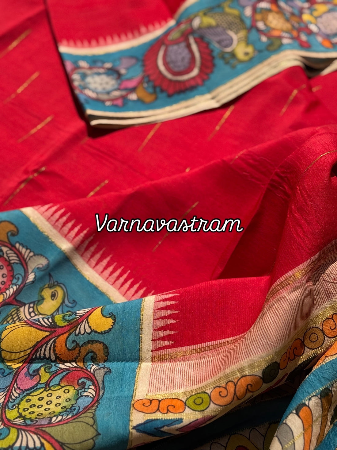 A gorgeous red korvai kanchivaram silk saree with korvai border Handdrawn and handpainted penkalamkari