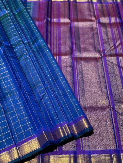 A stunner muthuseer zari kattam kanchivaram silk saree pure handwoven in a peacock blue