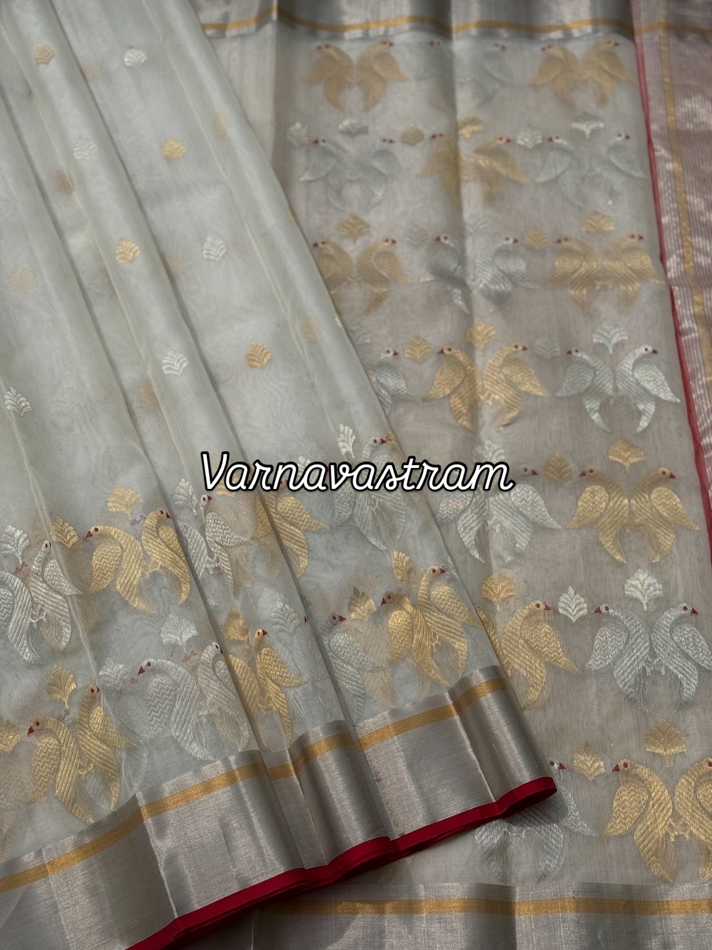 A ivory white handwoven chanderi silk saree with full jaal weave ek naal and meenakari