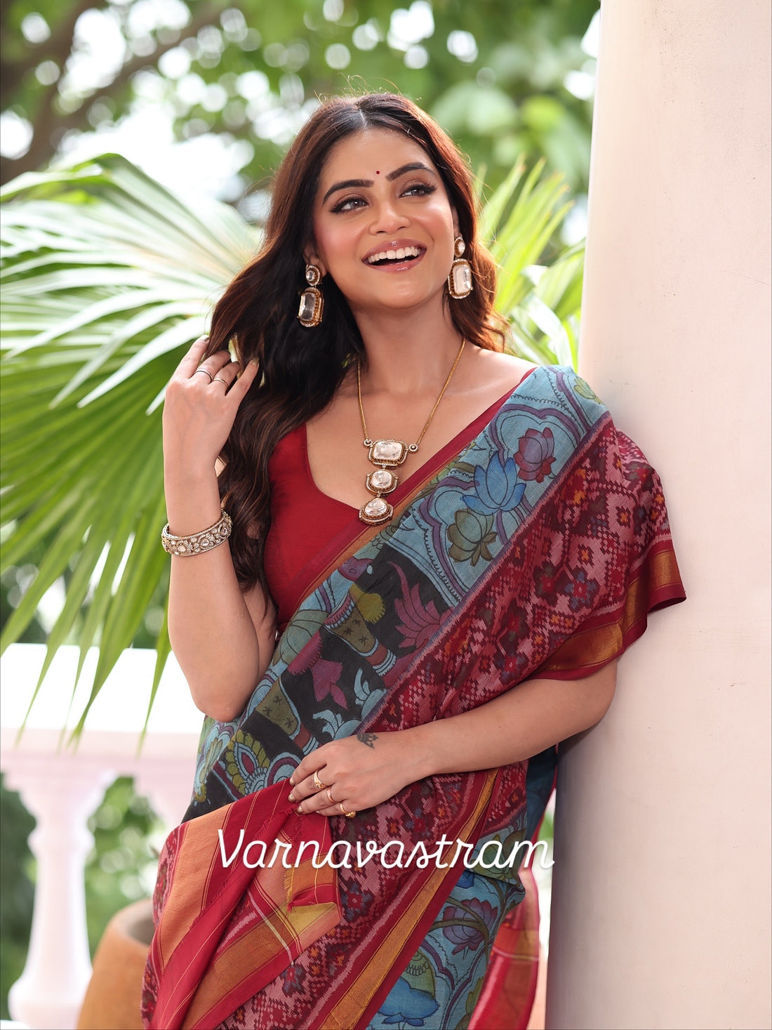 A stunner patola ikkat silk &amp;nbsp;tie dyed handwoven adorned with Handdrawn handpainted penkalamkari with natural colours on lotus theme