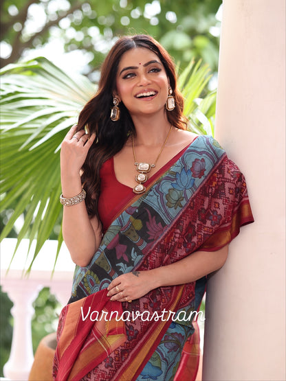 A stunner patola ikkat silk &amp;nbsp;tie dyed handwoven adorned with Handdrawn handpainted penkalamkari with natural colours on lotus theme