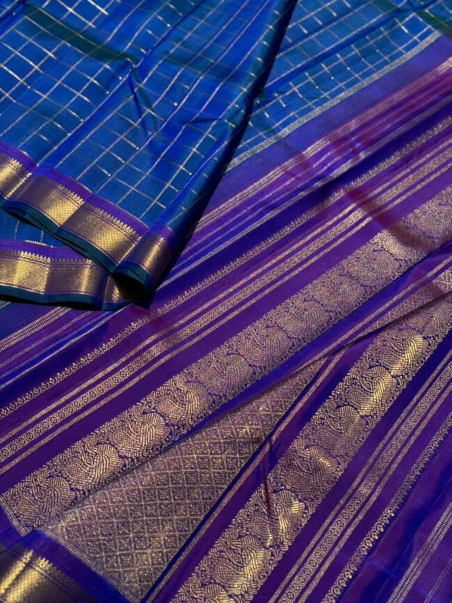 A stunner muthuseer zari kattam kanchivaram silk saree pure handwoven in a peacock blue