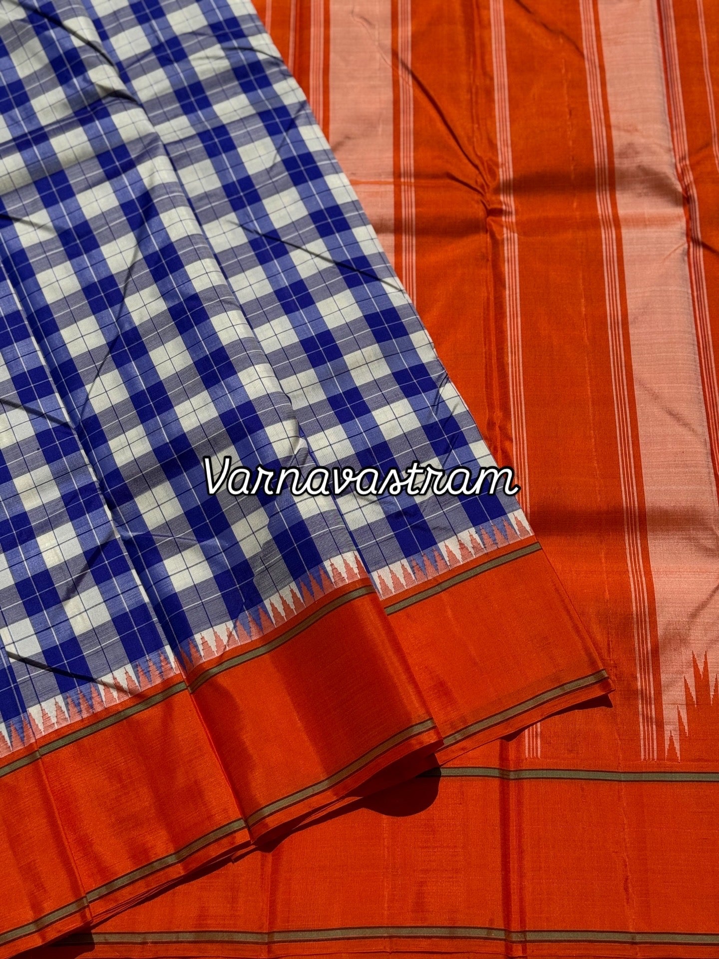A gorgeous blue with offwhite Burberry checks temple korvai kanchivaram silk saree