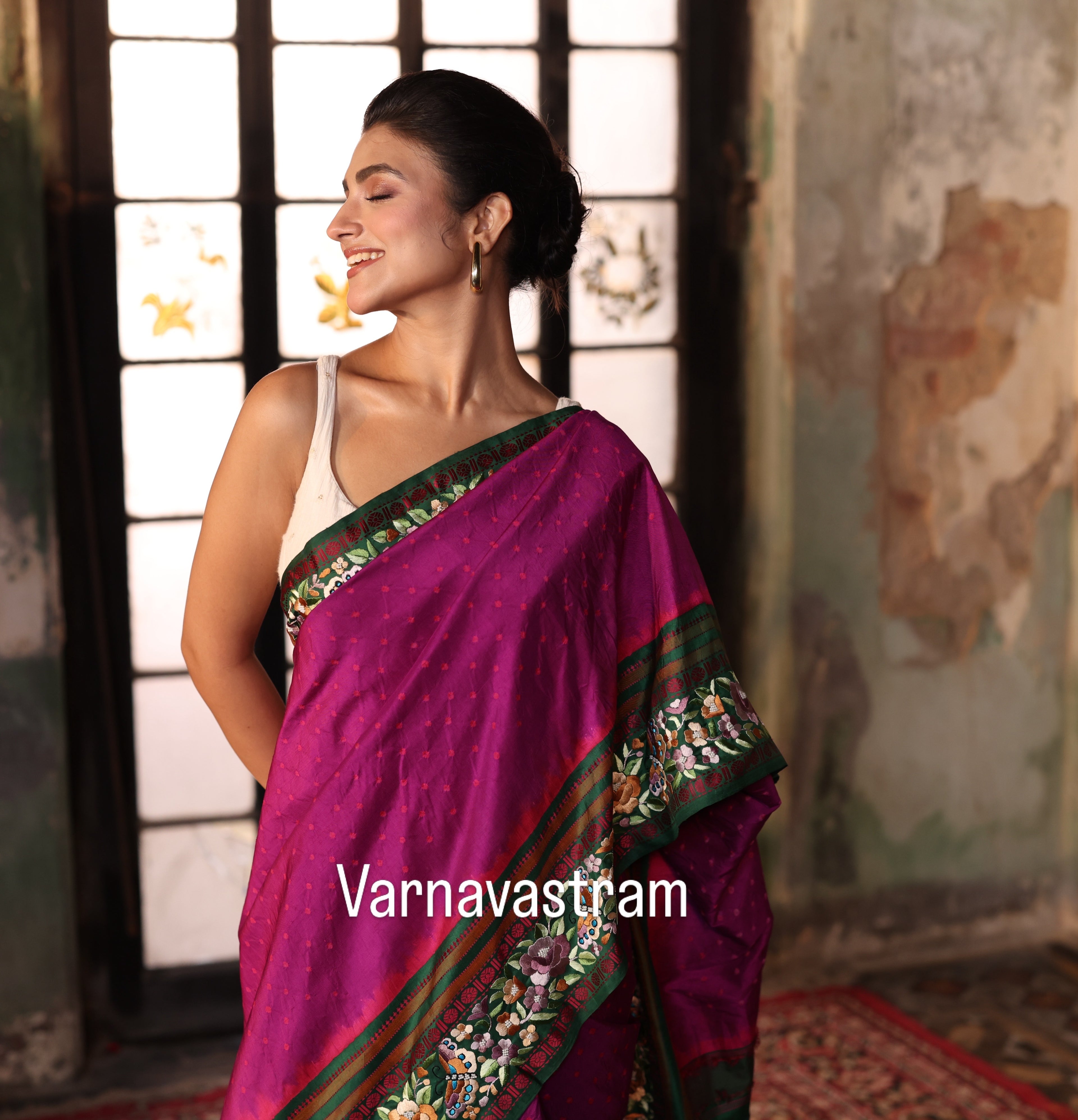 A plumpink kanchivaram weave silk saree with authentic Parsi gara work and handknotted rai Bhandej