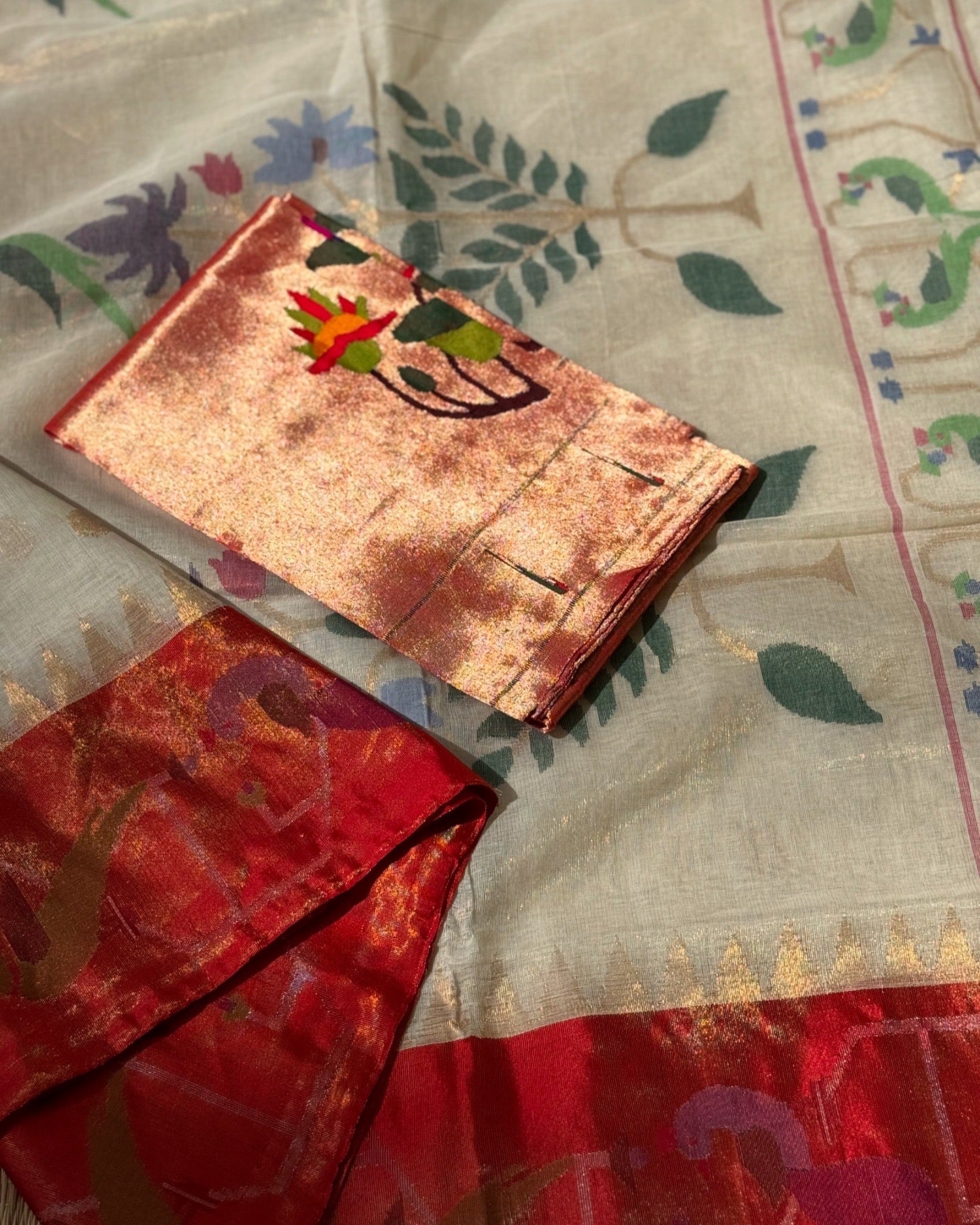 A DESIGNER EXCLUSIVE JAAL WEAVE PONDURU KHADHI WITH TISSUE MUNIYA PAITHANI BORDER WITH PARROT PEACOCK