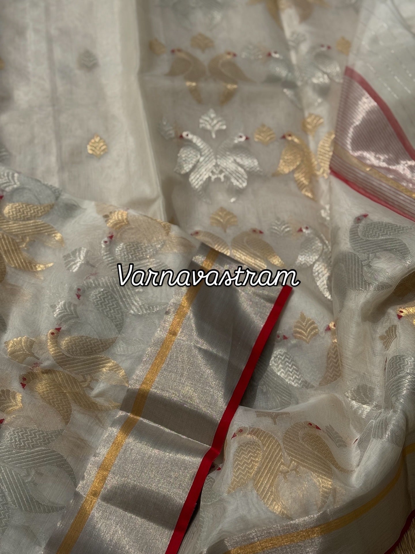 A ivory white handwoven chanderi silk saree with full jaal weave ek naal and meenakari