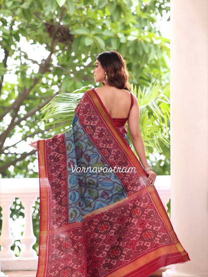 A stunner patola ikkat silk &amp;nbsp;tie dyed handwoven adorned with Handdrawn handpainted penkalamkari with natural colours on lotus theme