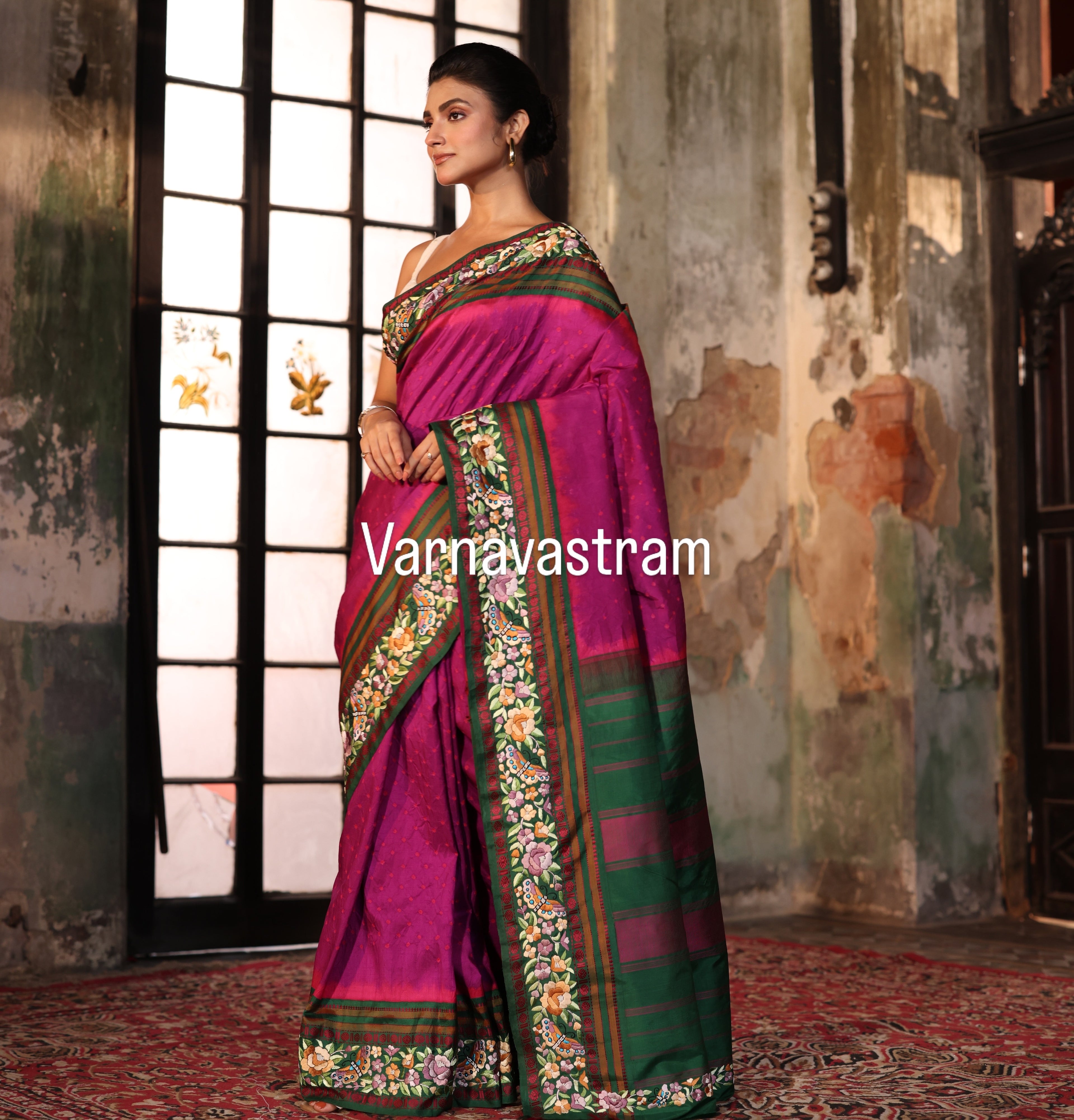 A plumpink kanchivaram weave silk saree with authentic Parsi gara work and handknotted rai Bhandej
