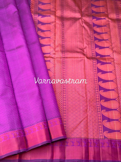 A gorgeous plum pink shade no zari kanchivaram silk saree with bambaramkan motifs