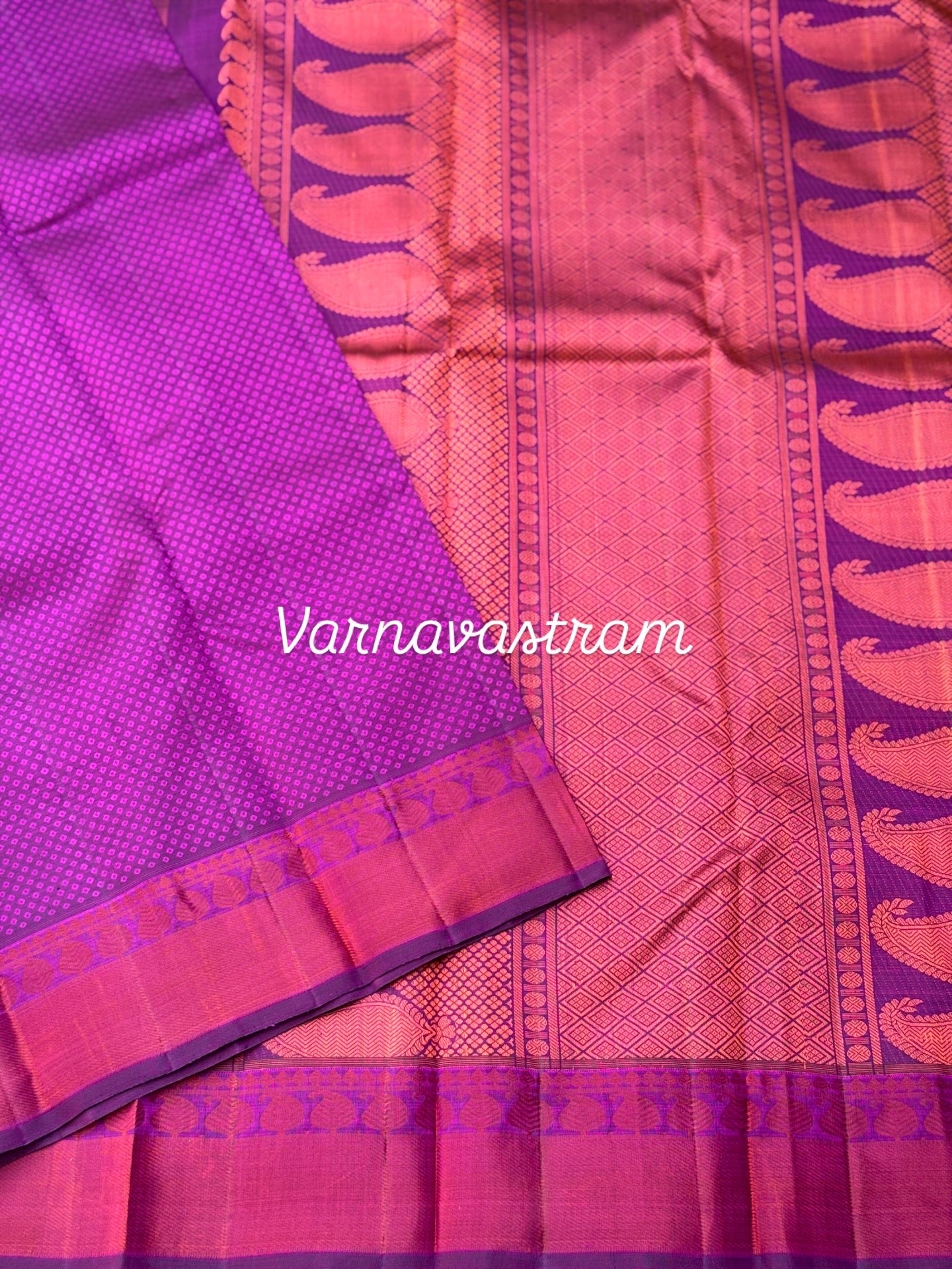 A gorgeous plum pink shade no zari kanchivaram silk saree with bambaramkan motifs