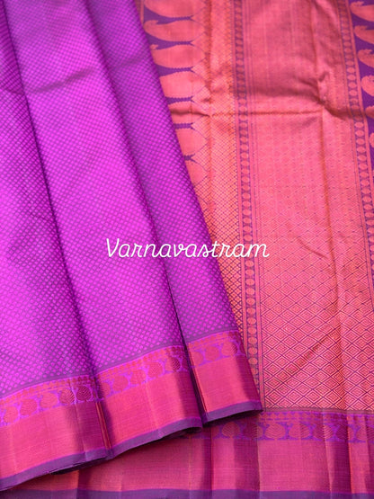 A gorgeous plum pink shade no zari kanchivaram silk saree with bambaramkan motifs