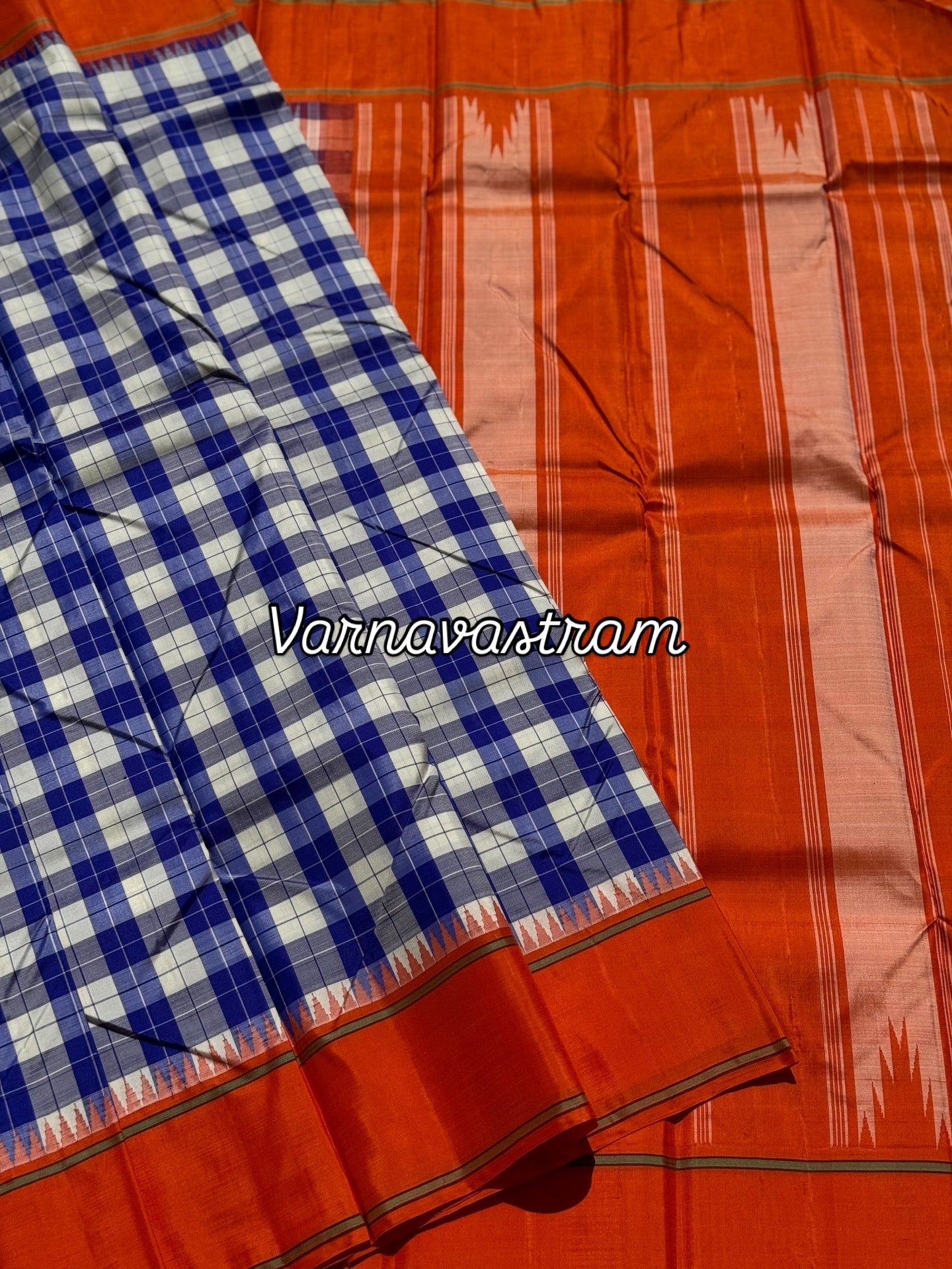 A gorgeous blue with offwhite Burberry checks temple korvai kanchivaram silk saree