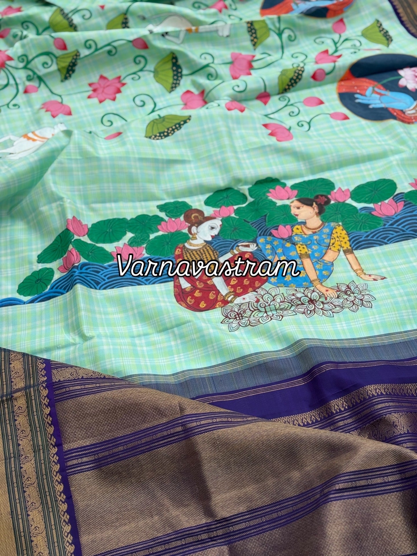 A stunner kanchivaram kattam korvai silk saree with foam green adorned with Handdrawn handpainted pichwai artwork