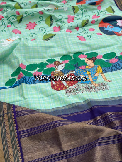 A stunner kanchivaram kattam korvai silk saree with foam green adorned with Handdrawn handpainted pichwai artwork
