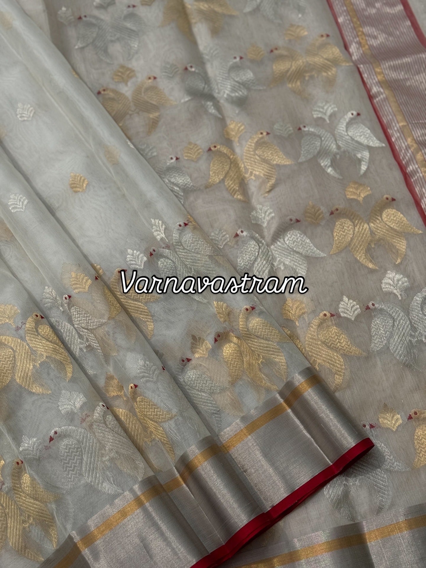 A ivory white handwoven chanderi silk saree with full jaal weave ek naal and meenakari