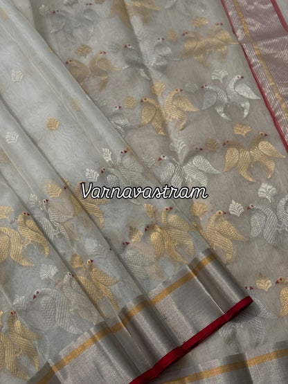 A ivory white handwoven chanderi silk saree with full jaal weave ek naal and meenakari