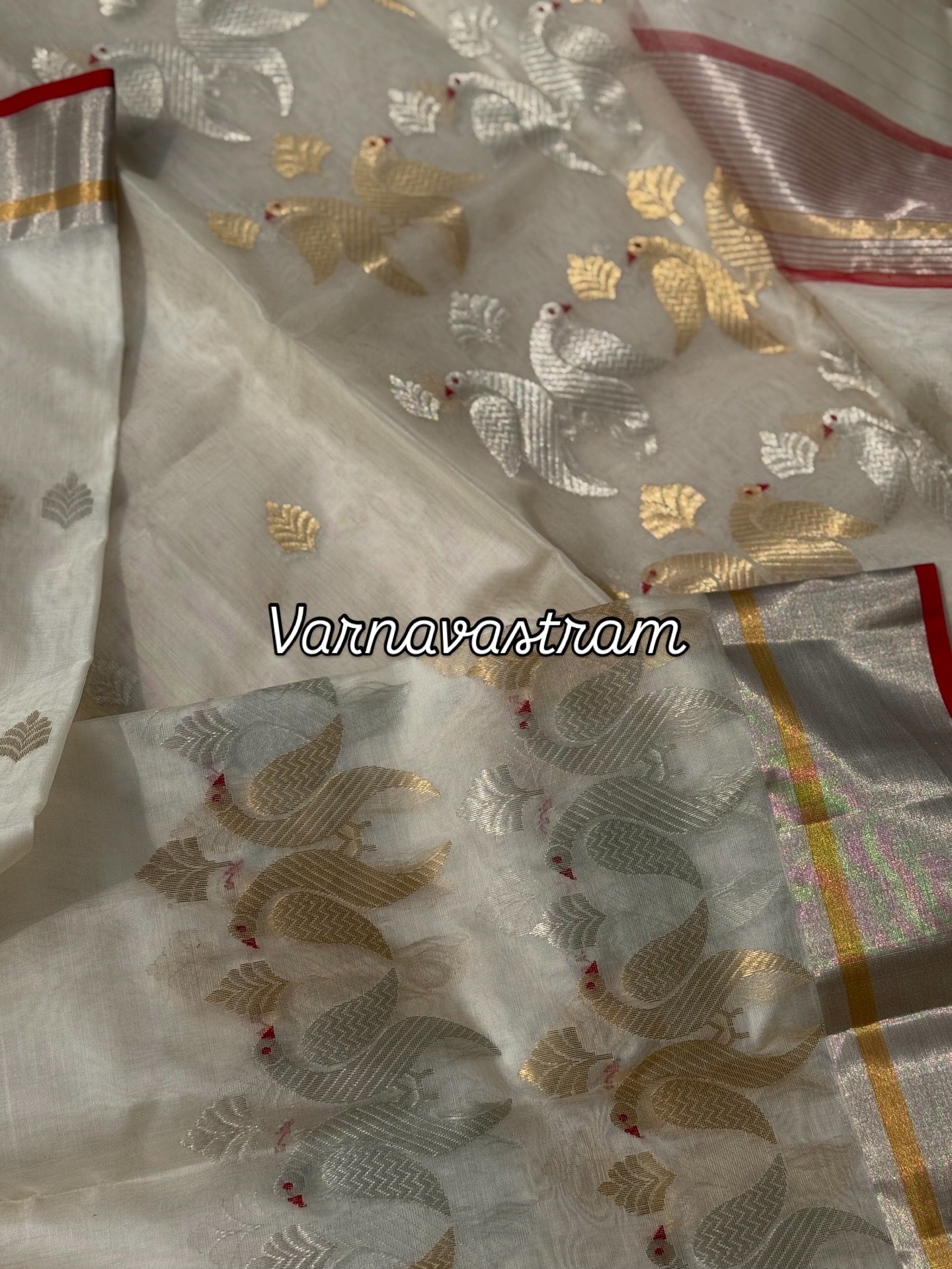 A ivory white handwoven chanderi silk saree with full jaal weave ek naal and meenakari