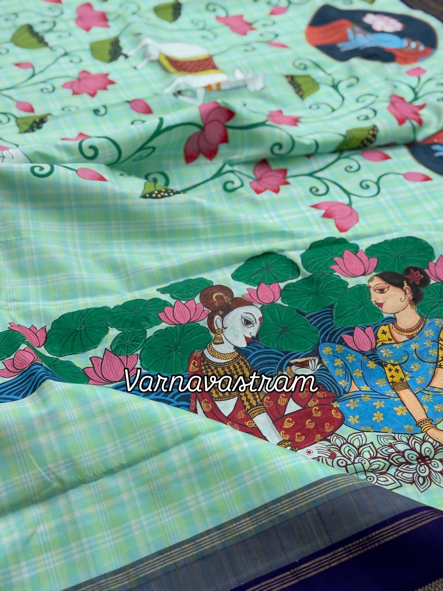 A stunner kanchivaram kattam korvai silk saree with foam green adorned with Handdrawn handpainted pichwai artwork
