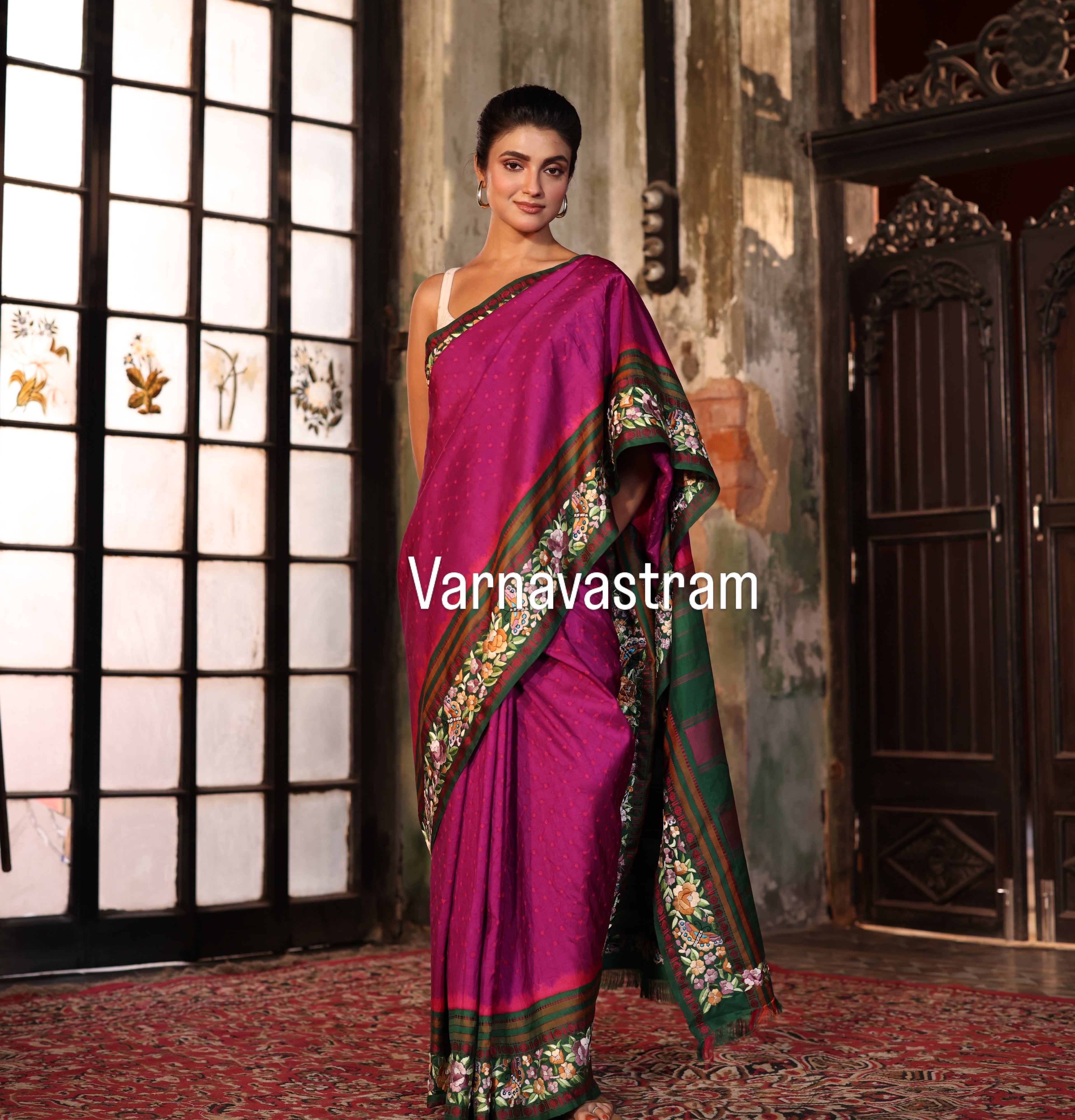 A plumpink kanchivaram weave silk saree with authentic Parsi gara work and handknotted rai Bhandej