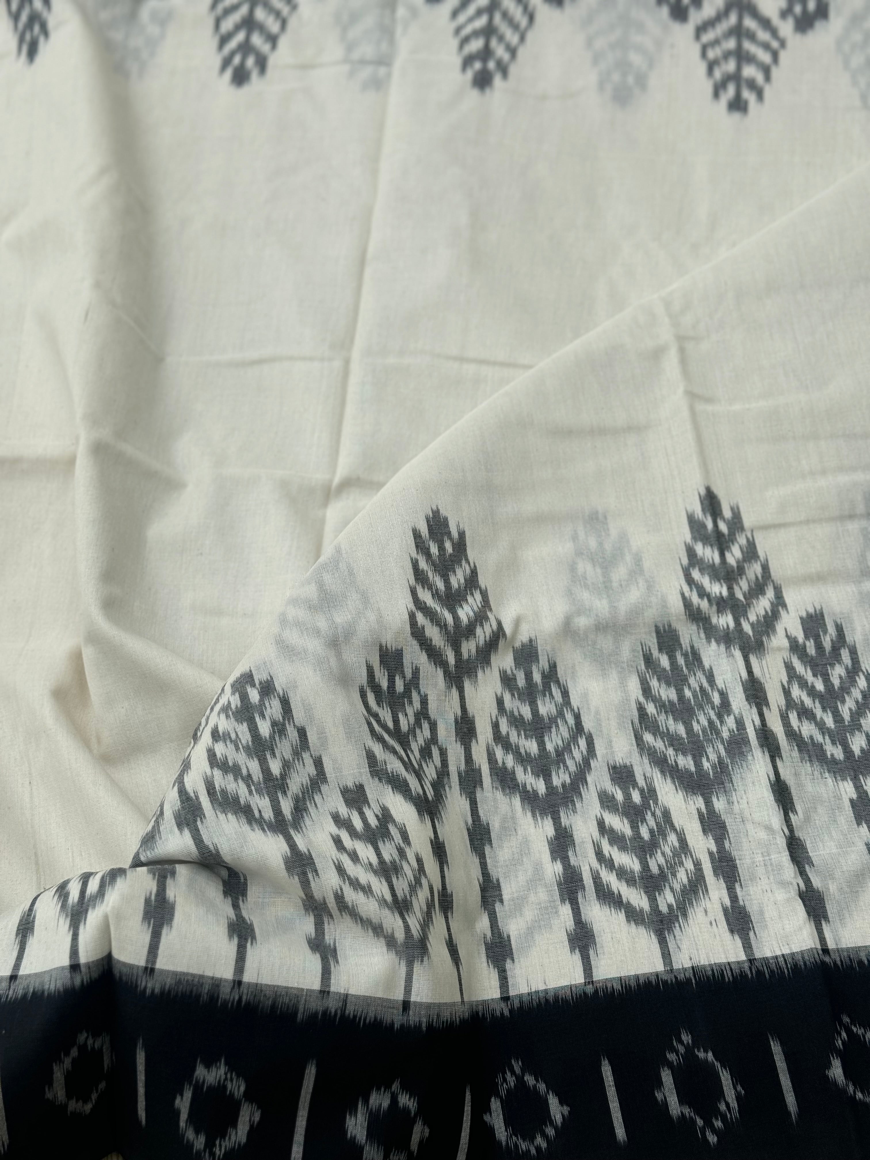 Ivory and  black handwoven weft single ikkat cotton saree
