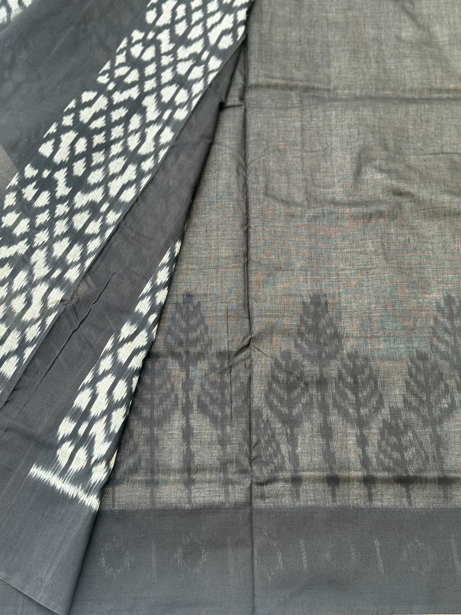 Ivory and  black handwoven weft single ikkat cotton saree