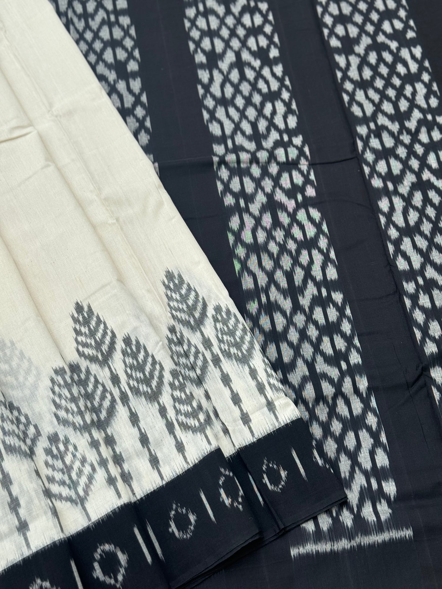 Ivory and  black handwoven weft single ikkat cotton saree