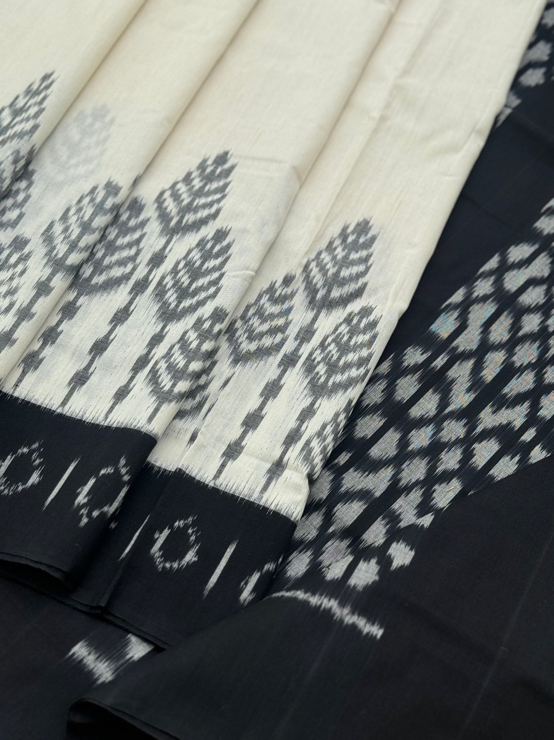 Ivory and black handwoven weft single ikkat cotton saree