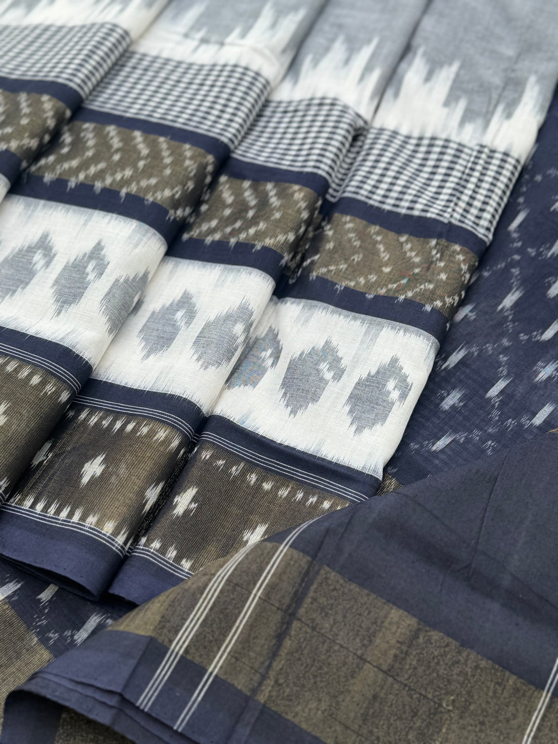 Ivory with deep navy blue zari border handwoven weft single ikkat cotton saree