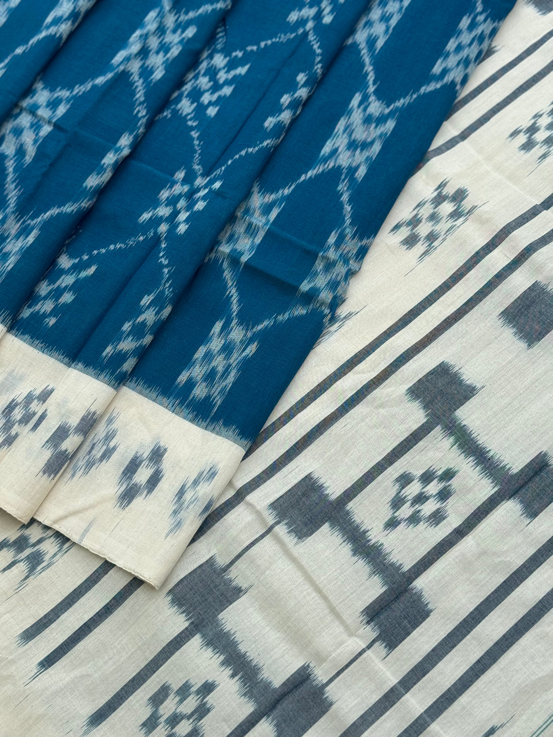 Ivory white w handwoven weft single ikkat cotton saree