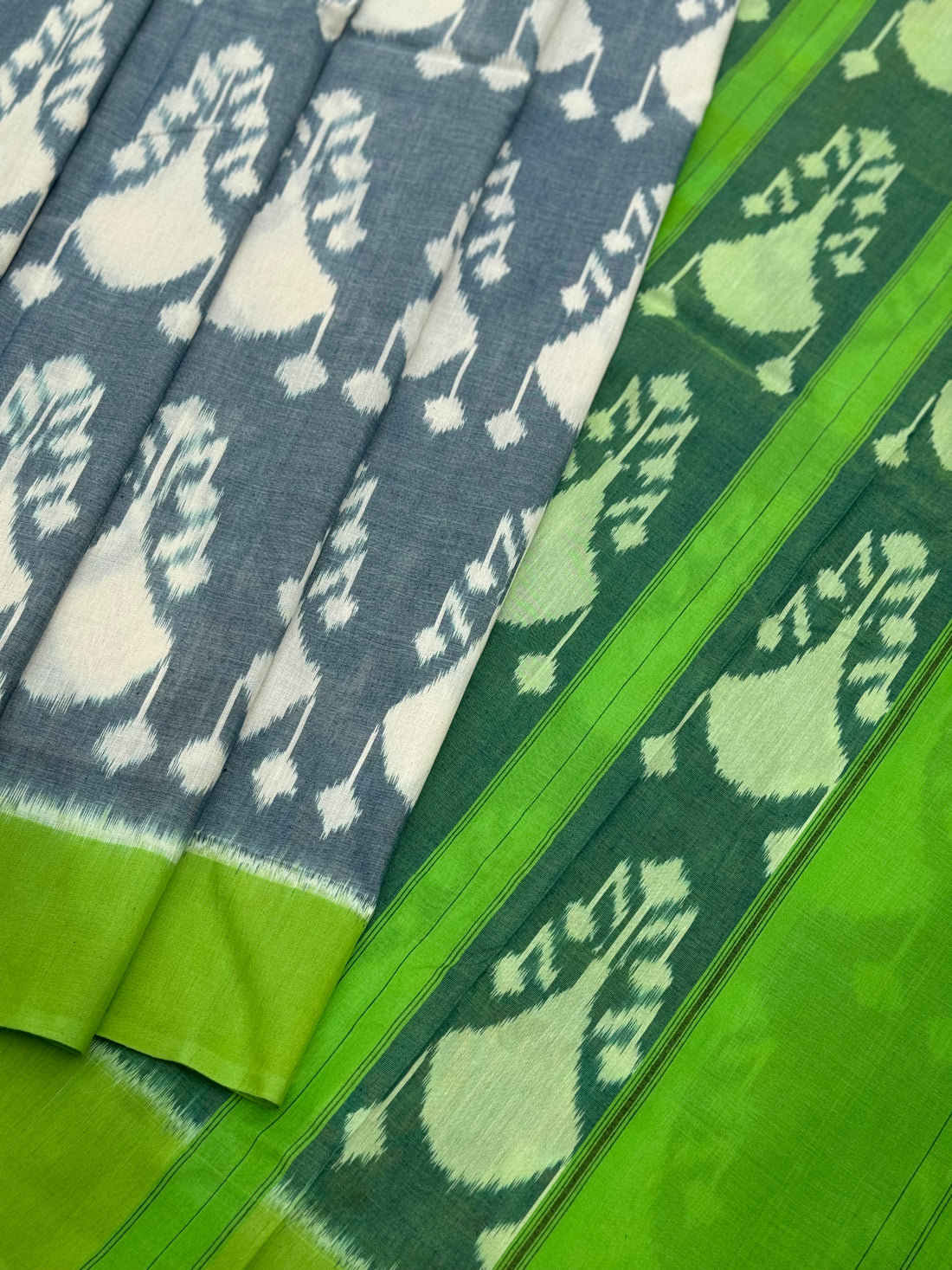Powder blue with green Uzbek motifs single ikkat cotton saree