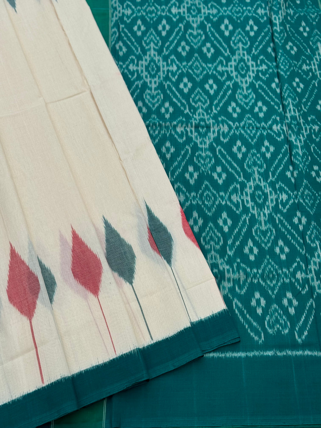 Ivory and teal handwoven weft single ikkat cotton saree