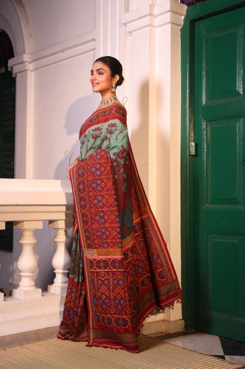 Handdrawn handpainted penkalamkari on handknotted Bhandej body with Katha handembroidery on a patola silk ikkat saree