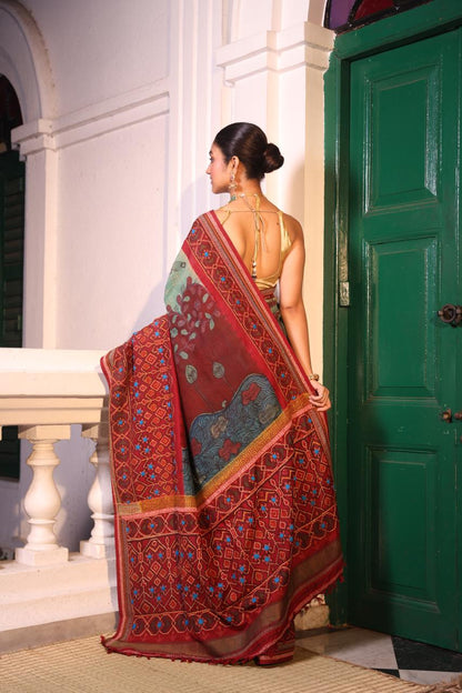 Handdrawn handpainted penkalamkari on handknotted Bhandej body with Katha handembroidery on a patola silk ikkat saree