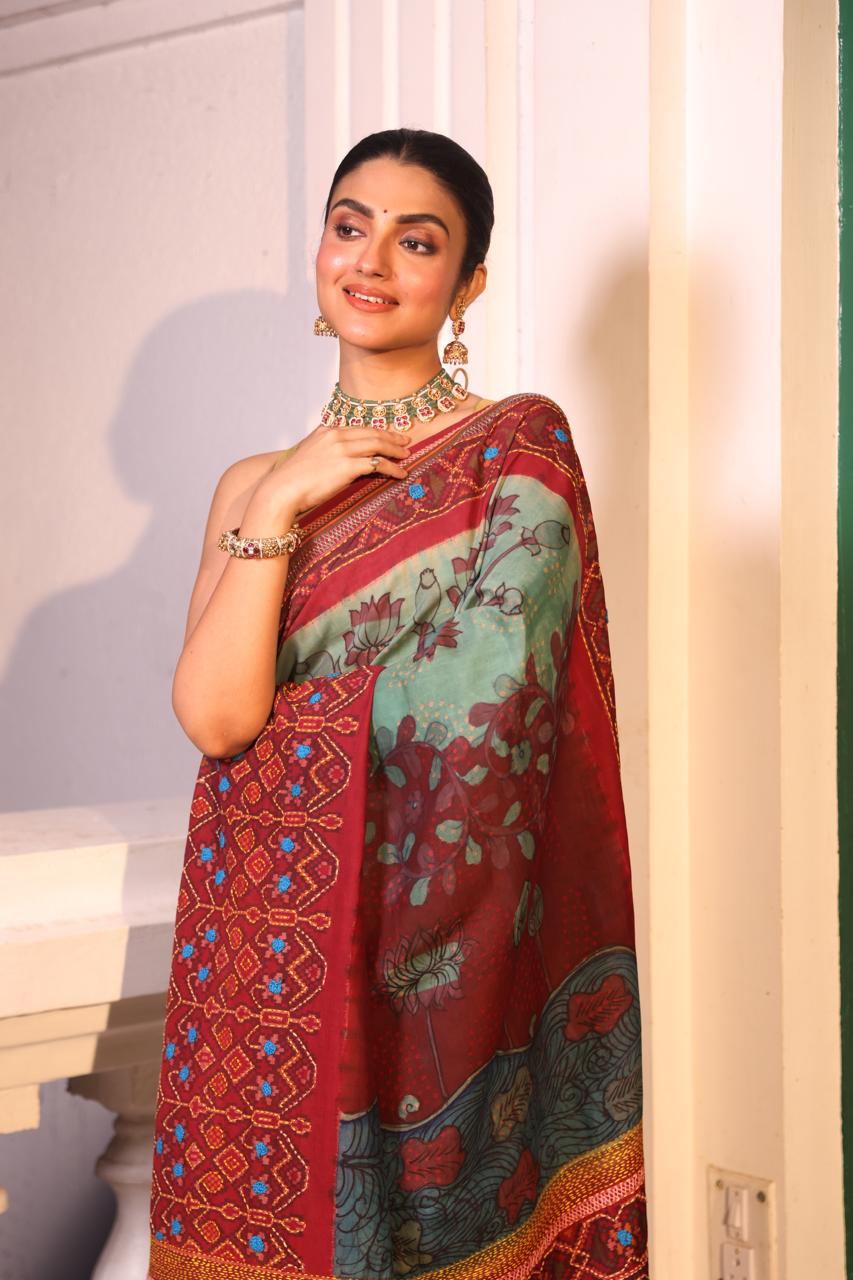 Handdrawn handpainted penkalamkari on handknotted Bhandej body with Katha handembroidery on a patola silk ikkat saree