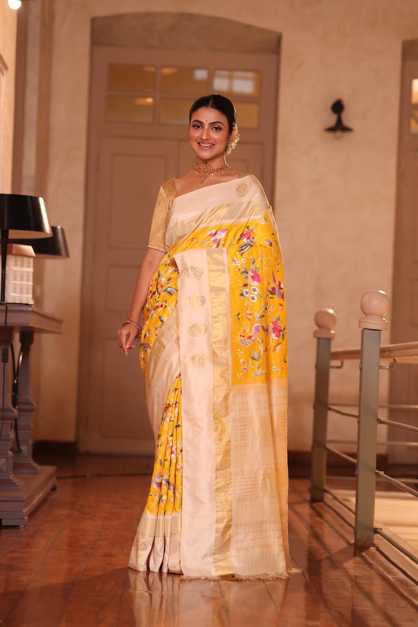 A pastel yellow Masterpiece kanchivaram weave silk saree with authentic Parsi gara work